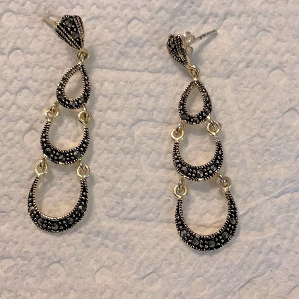 Gold and black dangle earrings that are 2 inches long and great condition.
